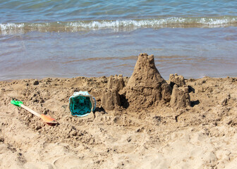 Fototapeta na wymiar Sand tower on the seashore.