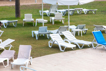 Sunbeds and deck chairs by the pool.