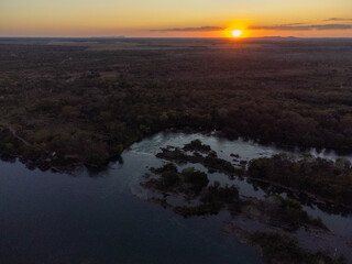 amazing red sunset under tocantins river in brazilian forest nature