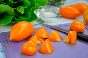 Tomatoes sliced on a cutting board