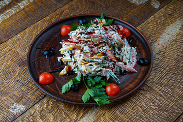 Georgian vegetable salad in a clay plate
