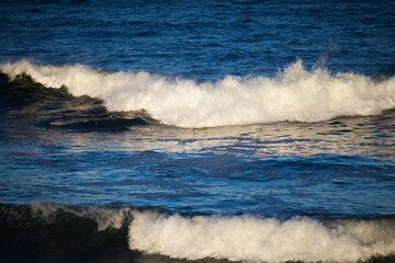 Ocean waves breaking on a rocky shore