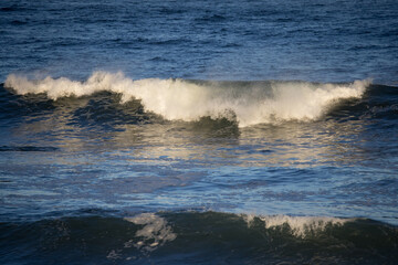 Ocean waves crashing on a rocky shore