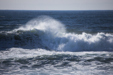 Ocean waves crashing on a rocky shore