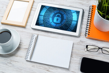 Web security and technology concept with tablet pc on wooden table