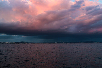 sunset sky with rainy clouds and pink or pastel color in mallorca