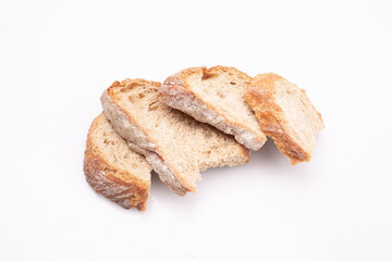 Slices of crispy bread, isolated. A few pieces of white bread, baguette on a white background.