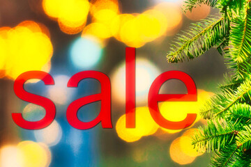sale sign and christmas light at night