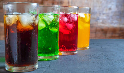 A lot of Soft drinks in colorful and flavorful glasses on the table,Glasses with sweet drinks with...