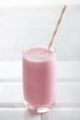 Red fruit smoothie on a white background