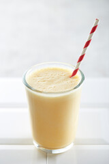 Banana smoothie on a white background