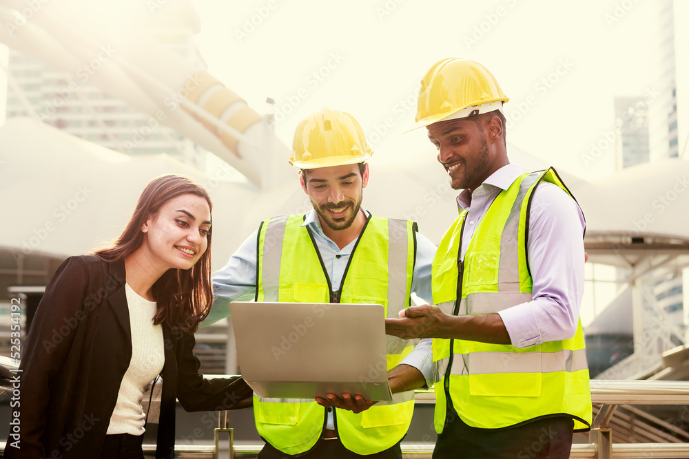 Wall mural a team of skilled executive engineers is discussing the details of the construction plan