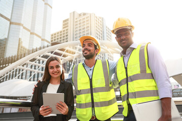 A team of skilled executive engineers is discussing the details of the construction plan