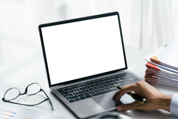 Fototapeta premium Young women working on her laptop with blank copy space screen for your advertising text message in office, Back view of business women hands busy using laptop at office desk.