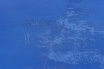 Blue peeling cracked off the outdoor flap wall, Dirty grunge abstract background from weathering.