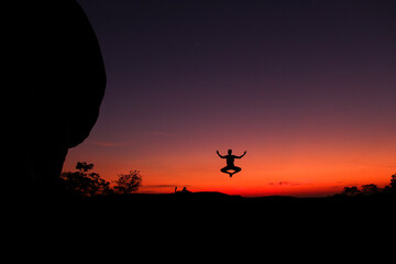 Dawn at  Pedra Pintada, Roraima, Brazil,  silhouette of a person