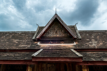 Wat Si Saket Temple in Vientiane, Laos. It was built in the Siamese style of Buddhist Art, with a surrounding terrace and an ornate five-tiered roof