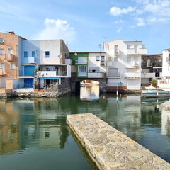 Fototapeta na wymiar Urban scene of residential buildings on a city canal.