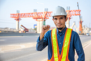 Asian Engineer construction are worker employee working by safety control helmet on site building