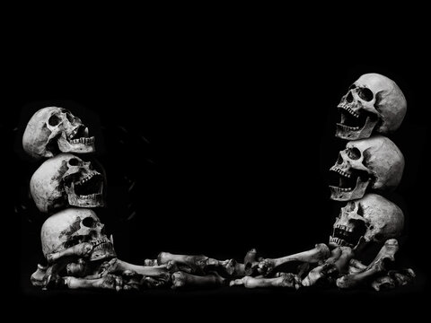 Awesome pile of skull human and bone on black cloth background, concept of scary crime scene of horror or thriller movies,Halloween theme, Still Life style, selective focus,