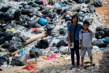 Poor children collecting garbage for sale Concept of pollution and Environment recycling old waste...