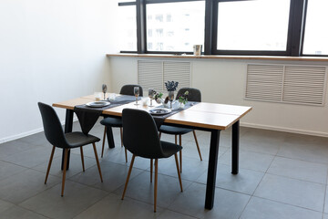 high-tech kitchen in grey. kitchen interior with natural materials. table setting