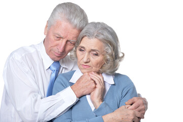 Portrait of sad senior couple isolated