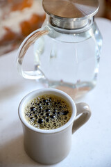 A filter coffee cup for breakfast served in a third-wave coffee-shop . Morning rituals