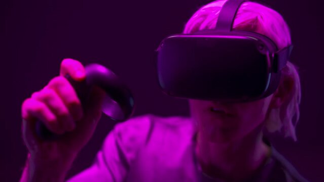 Closeup excited man experiencing VR headset videogame. Gamer virtual reality