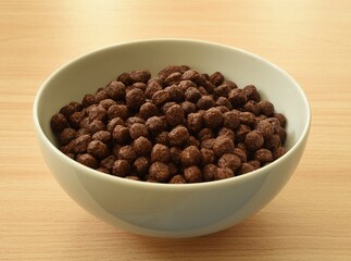 Whole grain cocoa flavor cereal in white adult size bowl.