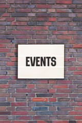 Fototapeta na wymiar Events message in light box on brick wall