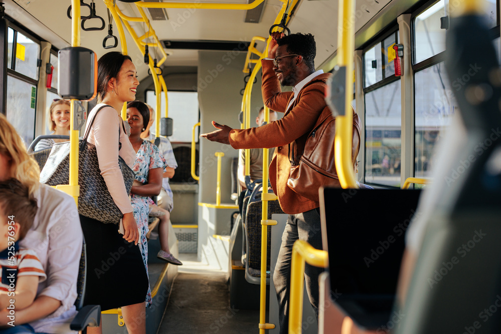 Poster passengers talking on city bus