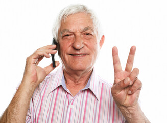 Portrait of positive old man hold new cellphone show v-sign sign recommend choose good modern technology