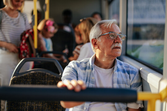 Elderly man in public transport