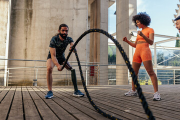 Athlete with bionic leg strength workout with ropes