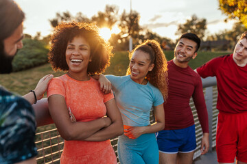 Athletes talking after exercise outdoors