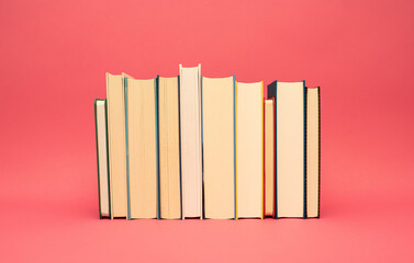 books on pink background blank