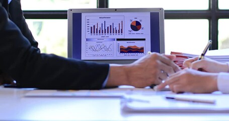 Successful teamwork Financial analysts analyze business financial reports on a digital tablet planning investment project during a discussion of corporate showing the results of their workspace 