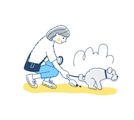 散歩中に犬のフンを拾う女性