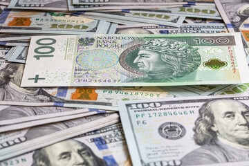 100 US  dollar and 100 polish zloty banknotes