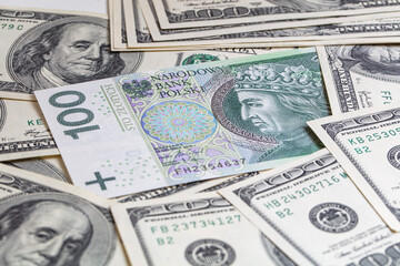 100 US  dollar and 100 polish zloty banknotes