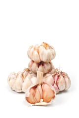 Several large heads of garlic, shot against a white background.