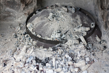 Cast iron Baking lid, Peka , covered with ashes.
Traditional Croatian cooking dish