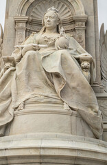London, England, UK - July 6, 2022: Victoria Memorial. Closeup of Enthroned queen with globe and...