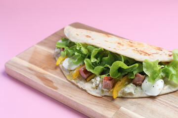 Italian cuisine , Piadina with sausage and cheese