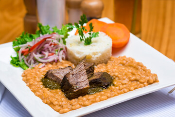 Frejoles con seco beans and meat stew de carne traditional peruvian food
