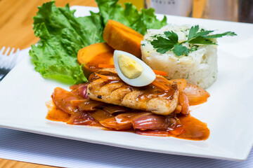 Escabeche fried fish onion salad boiled egg peruvian traditional gourmet food