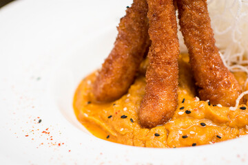 Deep fried shrimp on mashed pumpkin pure gourmet food