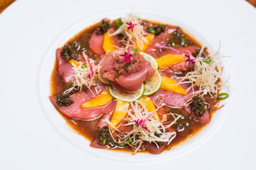 Ceviche marinade Uncooked raw fish with lemon mango and caper