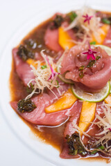 Ceviche marinade Uncooked raw fish with lemon mango and caper